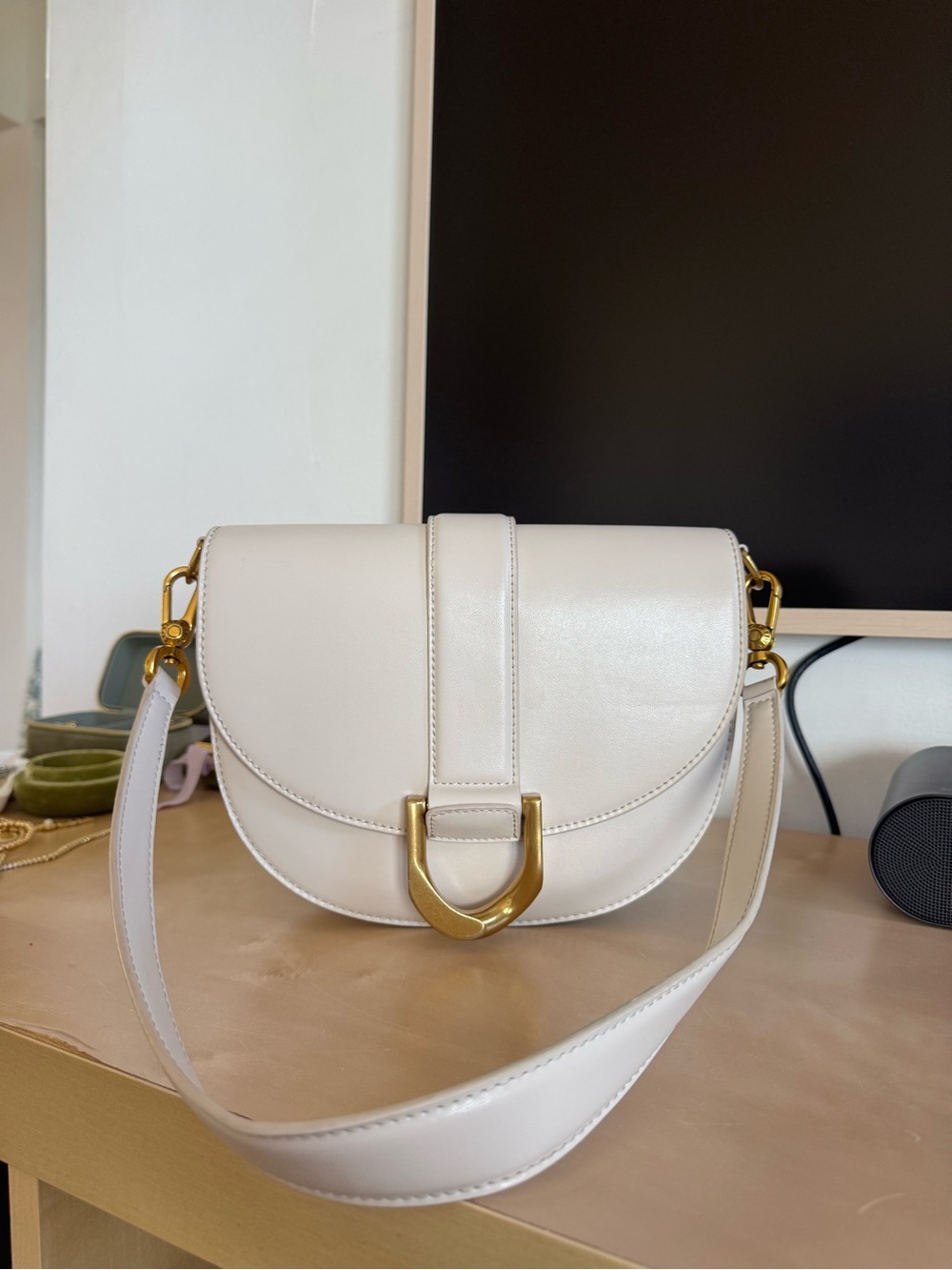 Charles and Keith Cream Saddle Crossbody Bag with Gold Hardware